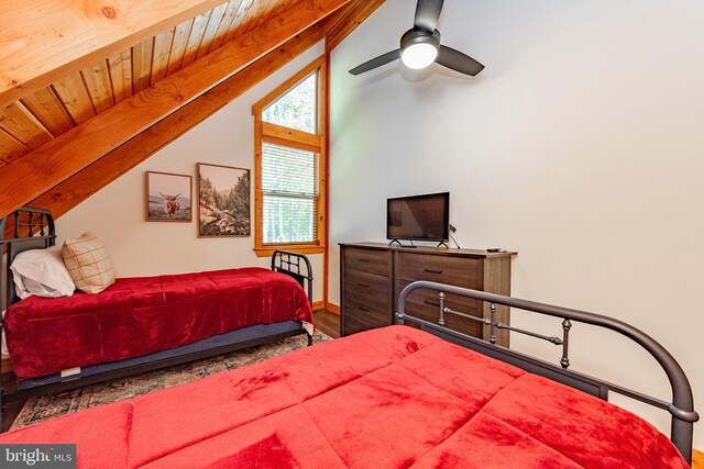 bedroom featuring wood-type flooring, vaulted ceiling, and ceiling fan