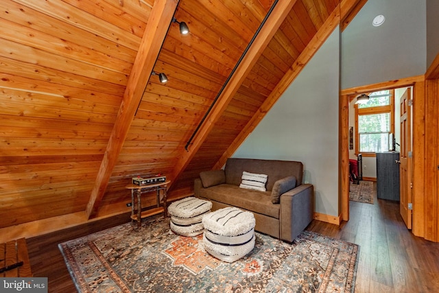 sitting room with wood ceiling, lofted ceiling with beams, and dark wood-type flooring