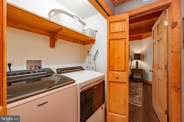 laundry area with separate washer and dryer and hardwood / wood-style floors