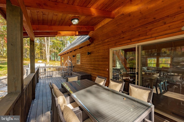 wooden terrace with outdoor lounge area