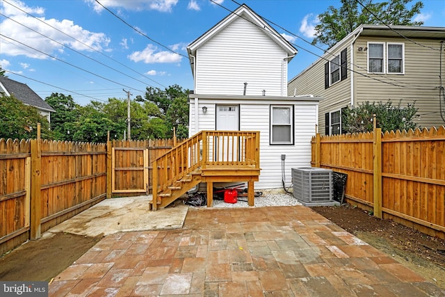 back of house featuring central AC and a patio area