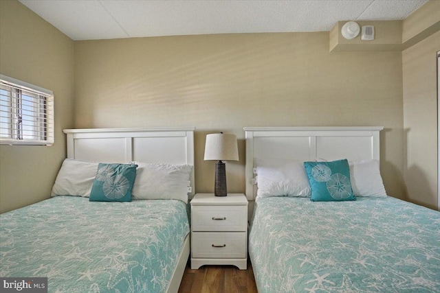 bedroom featuring dark hardwood / wood-style floors