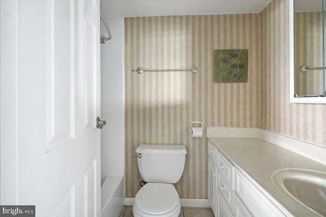 full bathroom featuring  shower combination, vanity, and toilet