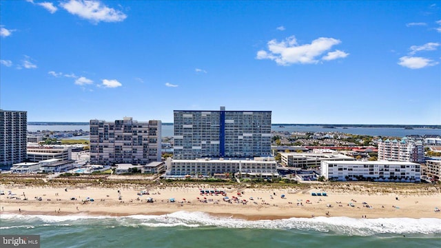 birds eye view of property featuring a view of the beach and a water view