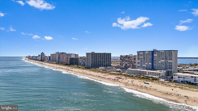 birds eye view of property with a view of the beach and a water view