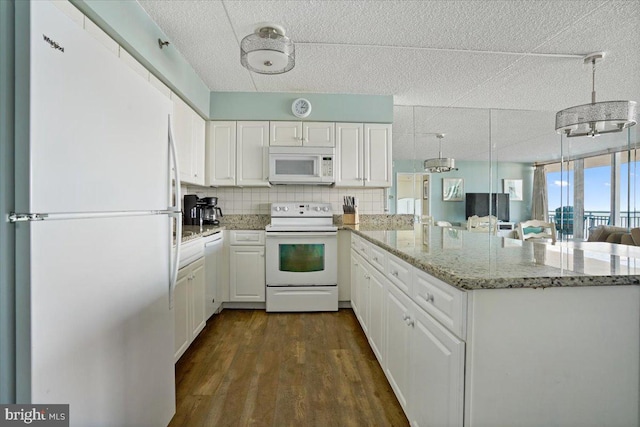 kitchen with decorative backsplash, dark wood-type flooring, white cabinets, white appliances, and a textured ceiling