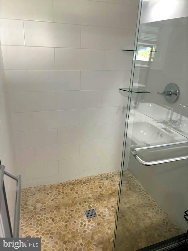 bathroom featuring an enclosed shower