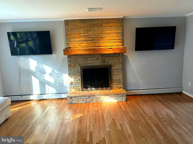 unfurnished living room with ornamental molding, wood-type flooring, a fireplace, and a baseboard radiator