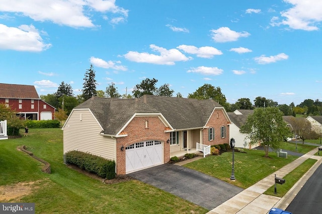 view of front of house featuring a garage and a front lawn