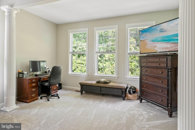 carpeted office space featuring ornate columns