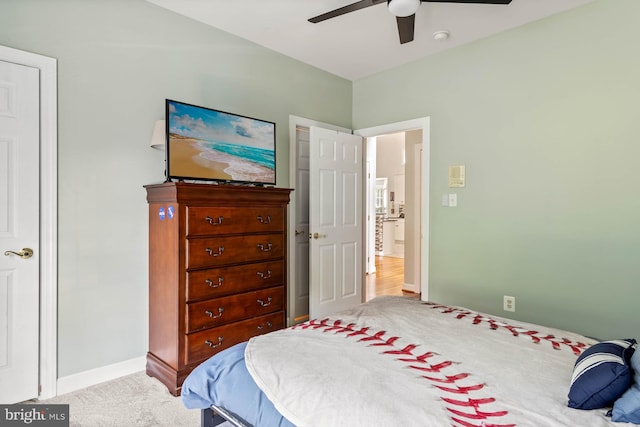 carpeted bedroom with ceiling fan