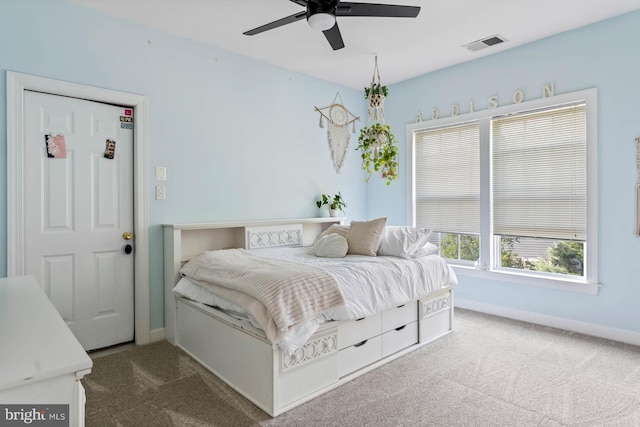 carpeted bedroom with ceiling fan