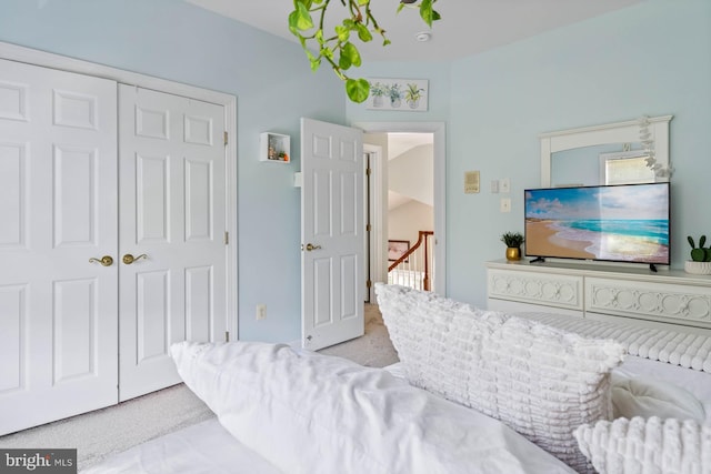 carpeted bedroom featuring a closet