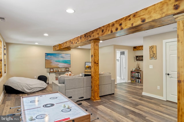 recreation room with ornate columns and dark hardwood / wood-style flooring