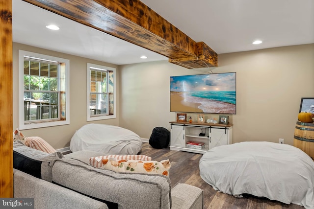 interior space featuring beam ceiling and dark hardwood / wood-style floors