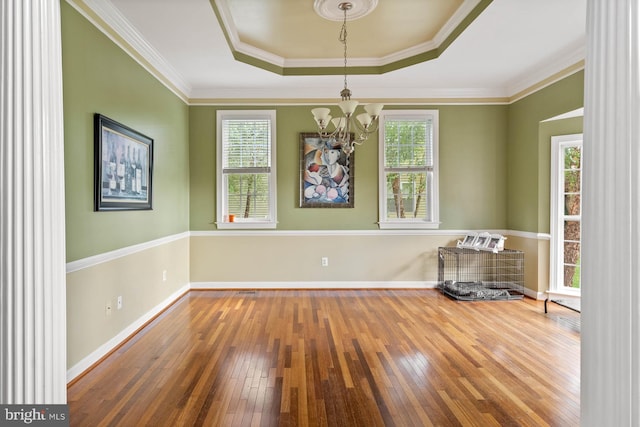 interior space with wood-type flooring, a chandelier, and a wealth of natural light