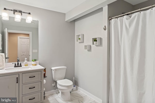 bathroom with walk in shower, vanity, and toilet