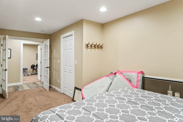 bedroom featuring light carpet