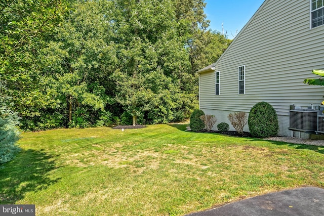 view of yard with central AC