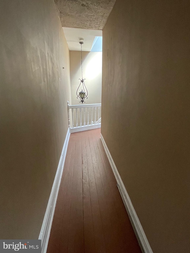 hallway featuring hardwood / wood-style flooring