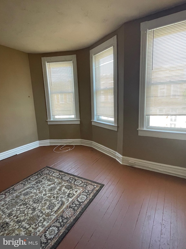 empty room featuring hardwood / wood-style flooring