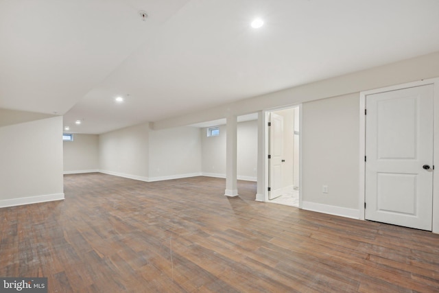 basement featuring dark wood-type flooring