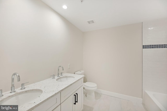 bathroom with vanity and toilet