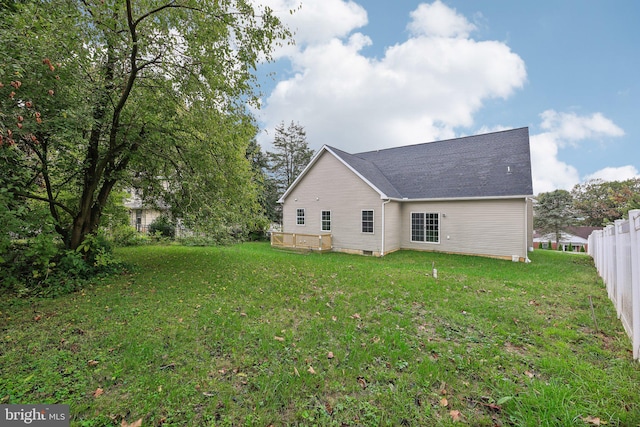 rear view of house with a lawn