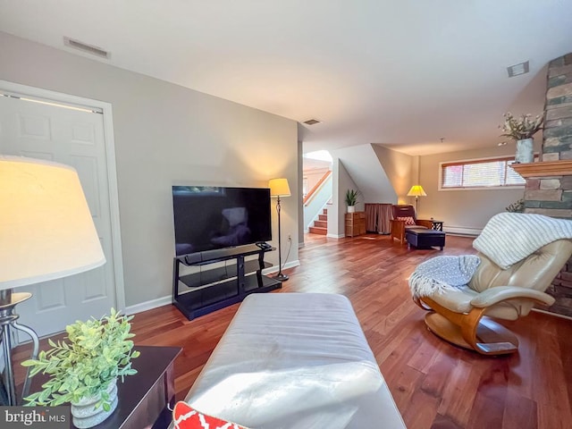 living room featuring hardwood / wood-style floors and baseboard heating