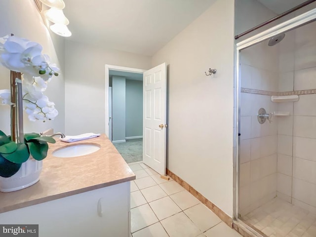 bathroom featuring vanity, walk in shower, and tile patterned floors