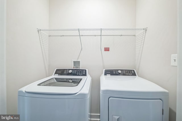 laundry room with independent washer and dryer