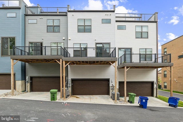 exterior space featuring a balcony and a garage