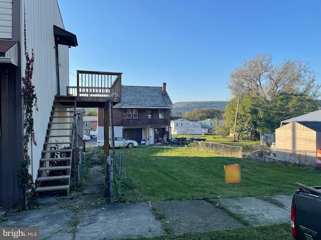 view of yard featuring a wooden deck