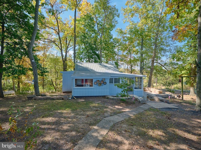 563 E Dark Hollow Road 245Kyle Ln, Pipersville, PA 18947 - view of front of home with metal roof and a sunroom