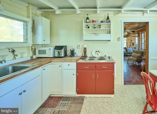 563 E Dark Hollow Road 245Kyle Ln, Pipersville, PA 18947 - kitchen with ceiling fan, electric stovetop, beam ceiling, a sink, and white microwave