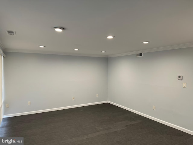 unfurnished room featuring crown molding and dark hardwood / wood-style flooring