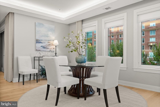 dining space with light hardwood / wood-style flooring