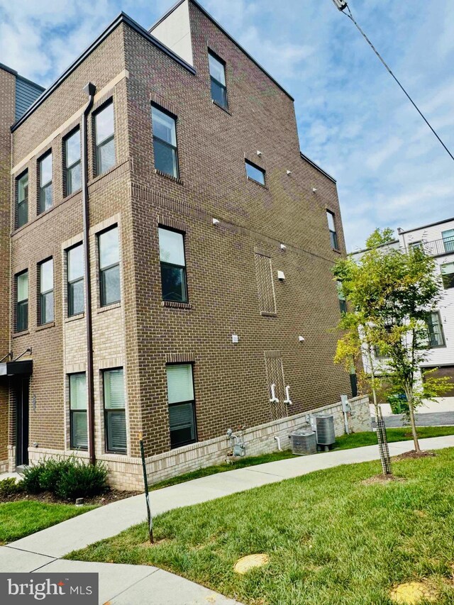 view of building exterior with cooling unit