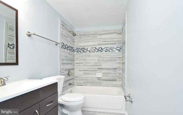 full bathroom with vanity, tiled shower / bath combo, and toilet