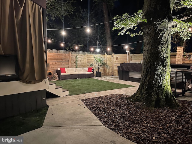 yard at twilight with a patio area