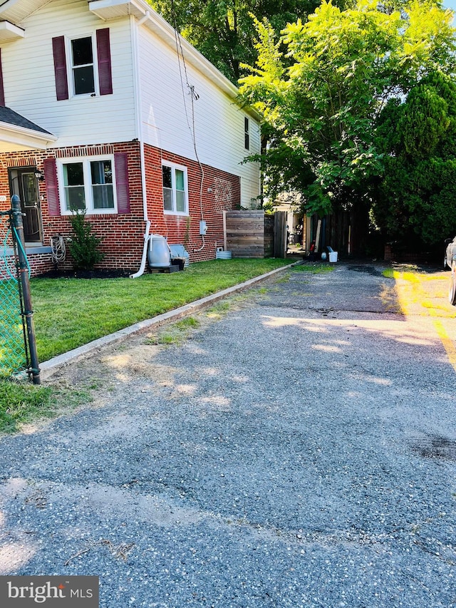 view of property exterior featuring a yard