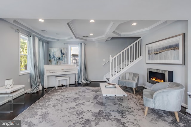 living room featuring dark hardwood / wood-style floors and ornamental molding