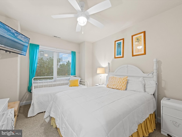 bedroom featuring ceiling fan and carpet flooring