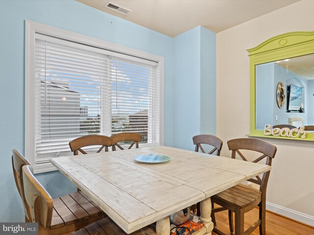 dining space featuring hardwood / wood-style flooring