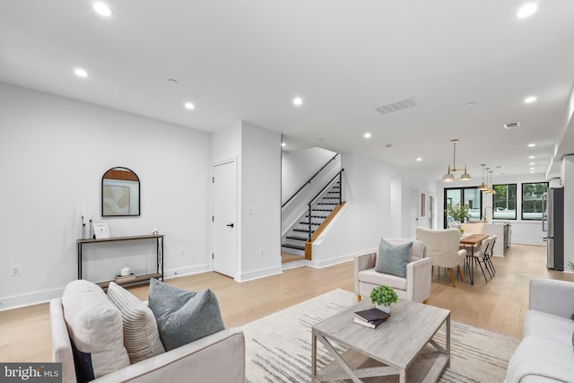 living room with light hardwood / wood-style flooring