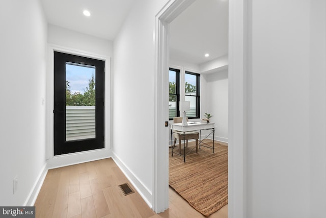 doorway to outside featuring light hardwood / wood-style flooring