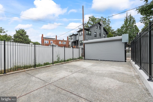 view of patio / terrace featuring a garage and an outdoor structure