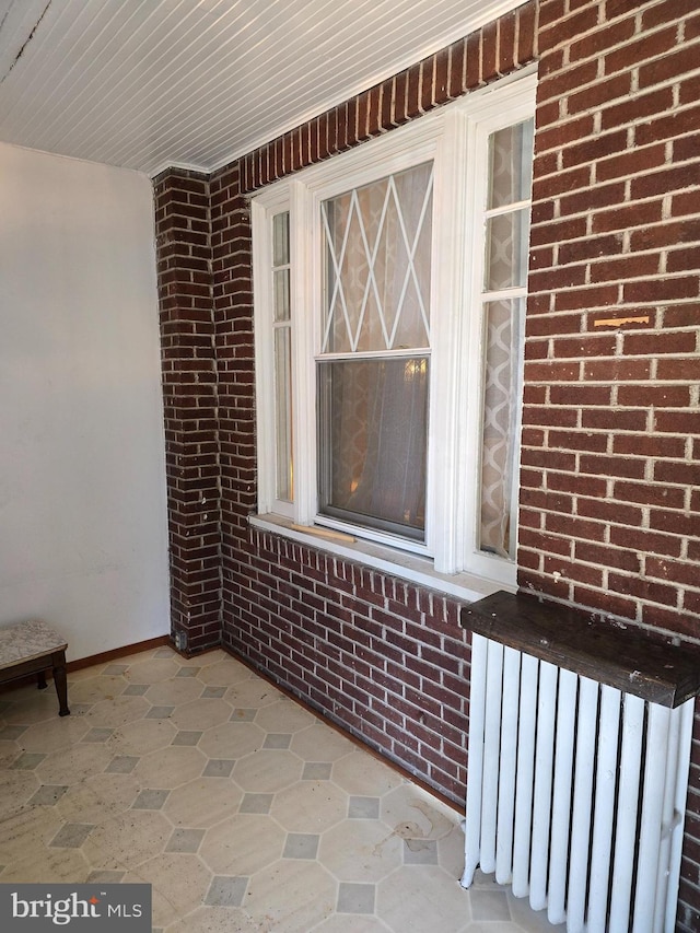 property entrance featuring radiator heating unit