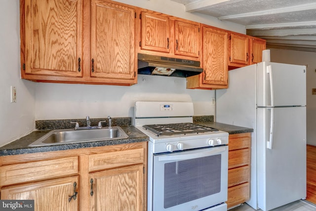 kitchen featuring white appliances, light hardwood / wood-style floors, beamed ceiling, and sink