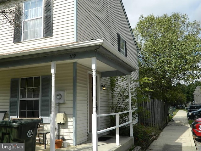 view of side of property featuring a porch